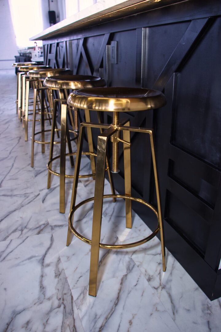 Close-up of gold bar stools
